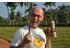 The photo shows Johannes Gutmann holding a cinnamon bark in his hand.